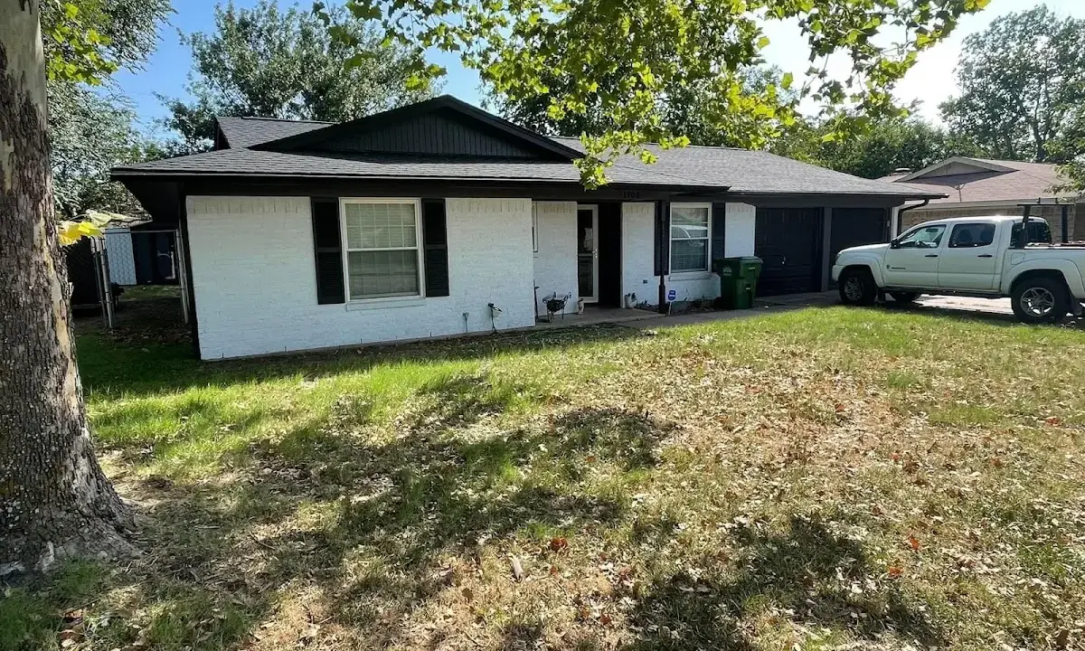 Professional roofing crew working on a residential roof in Plainsboro